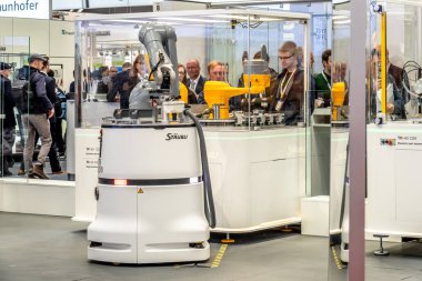 Hannover , Germany - April 02 2019 : Staubli is presenting the newest generation of cobots - Collaborative robots - and HGVs at the HANNOVER FAIR clipart