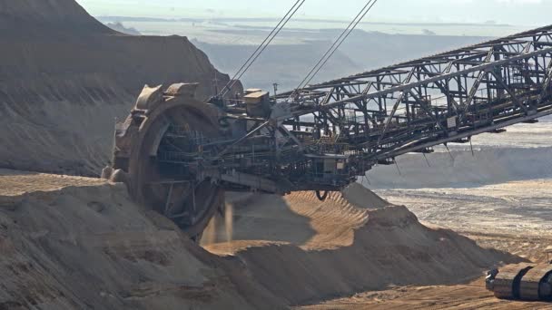 Bucket-wheel excavator in open-cast mining pit in Germany — Stock Video