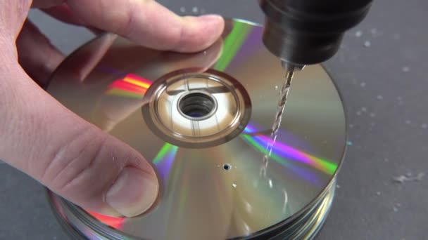 Concept of deleting big data by drilling a hole into the DVD RAM — Stock Video