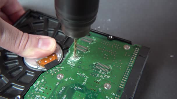 Concept of deleting big data by drilling a hole into the harddisk — Stock Video