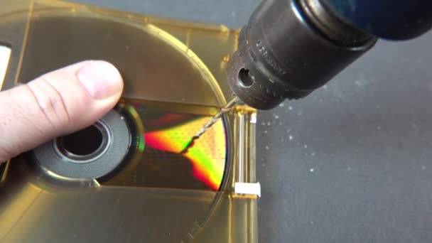 Concept of deleting big data by drilling a hole into the DVD RAM — Stock Video