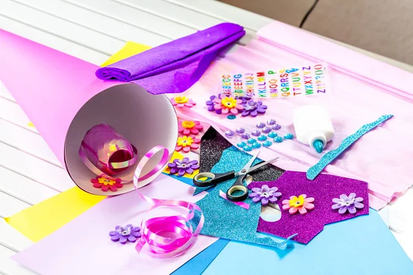 Making paper crafts for candy cone first day of school — Stock Photo, Image
