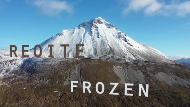 Flying through the letter Frozen in irish and english towards Errigal Mountain in Ireland — Stock Video