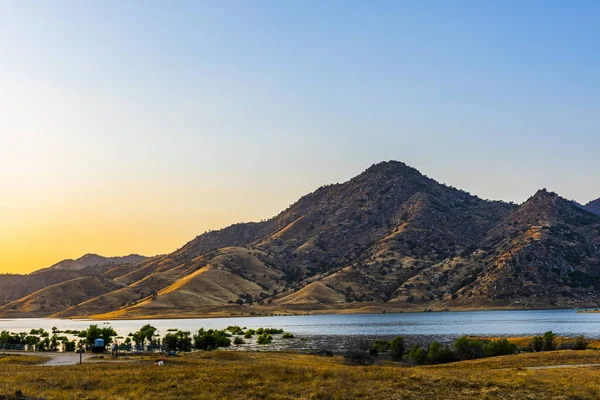 The lake Kaweah is water reservoir on Kaweah river beneath Sierra Nevada mountains, California, USA. Brilliant sunset time