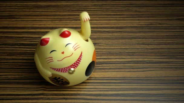 Lucky Asian Cat Wooden Background — Stock Video