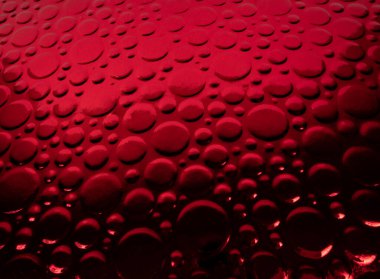 Yakın plan kırmızı metalik daireler arka plan
