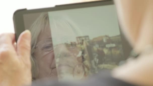 Senior Caucasian Woman Looking Old Photos Herself Young Woman Tablet — Stock Video