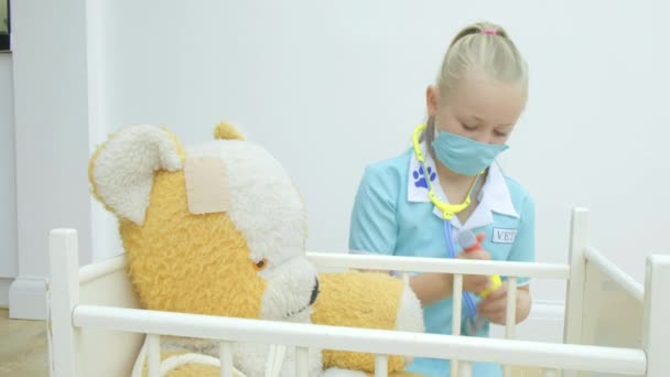 Pre Teen Caucasian Girl Nursing Her Teddy Bear — Stock Video