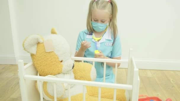 Pre Teen Caucasian Girl Nursing Her Teddy Bear — Stock Video