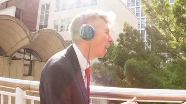 Smart Carefree Middle Aged Caucasian Businessman Wearing Headphones Listening Music — Stock Video