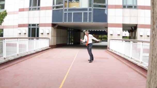 Happy Carefree Caucasian Businessman Leaving Office Wearing Headphones Listening Music — Stock Video