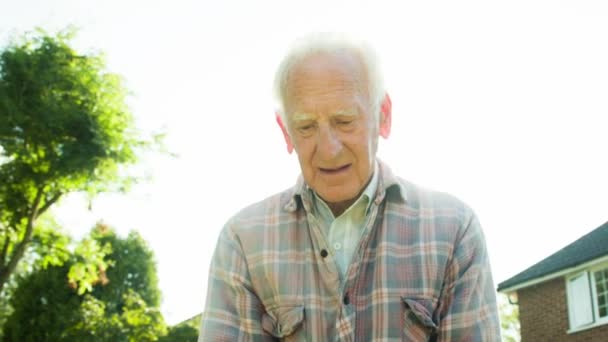 Backlit Portrait Active Retired Senior Caucasian Male Gardener — Stock Video