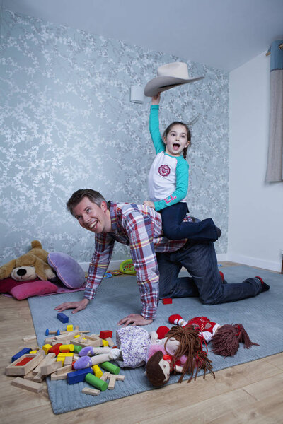 Young girl having a piggyback ride