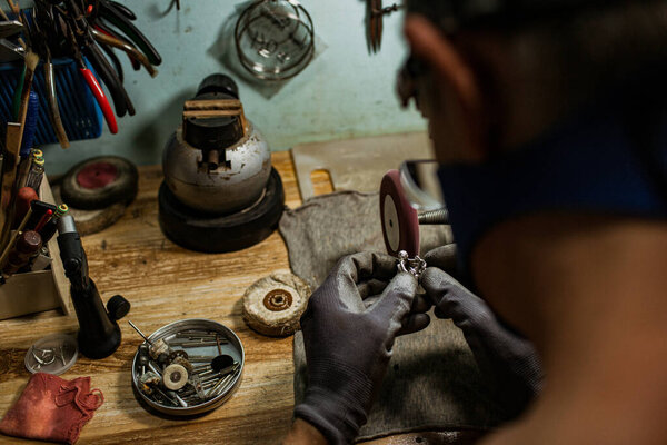 close-up partial view of jeweler making a silver ring on the island of Bali, Indonesia