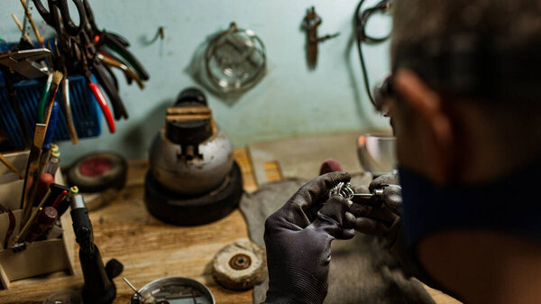 close-up partial view of jeweler making a silver ring on the island of Bali, Indonesia