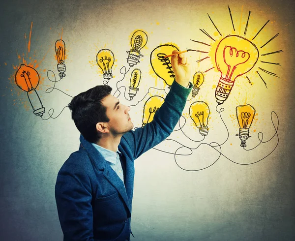 Thoughtful Businessman Drawing Imaginative Shining Light Bulbs Different Business Thinking — Stock Photo, Image