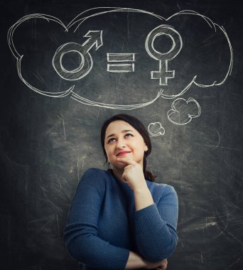 Casual young woman holding hand under chin looking up dreaming as a thought cloud showing gender equality concept with male and female symbol over blackboard background. Sex sign social issue metaphor clipart