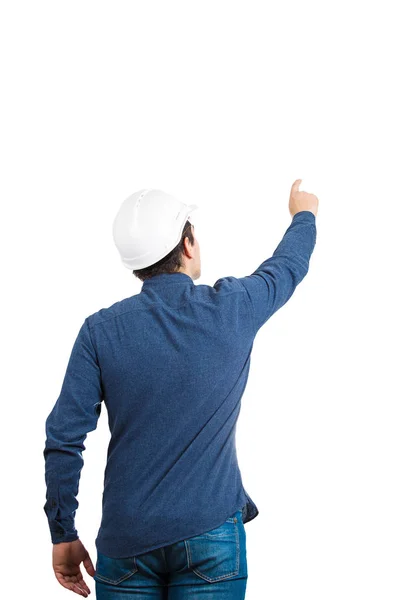 年轻人工程师戴着防护头盔的背景视图 他的手指被用手指指向上面 就像按下一个富有想象力的按钮 在白色背景中被隔离 有复制空间 — 图库照片