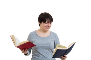 Şüpheli genç kadın öğrenci ya da öğretmen iki açık tutan bir kırmızı ve mavi, başka hangi birini okumak için seçtiğiniz kitaplar. Zor karar verme ideal, eğitim kavramı,.