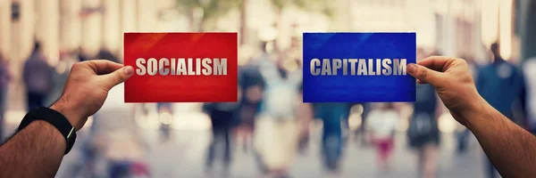 Социализм против капитализма — стоковое фото
