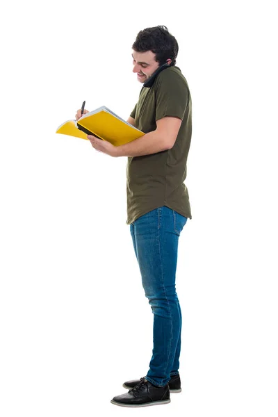 Homem falando ao telefone e fazendo anotações — Fotografia de Stock