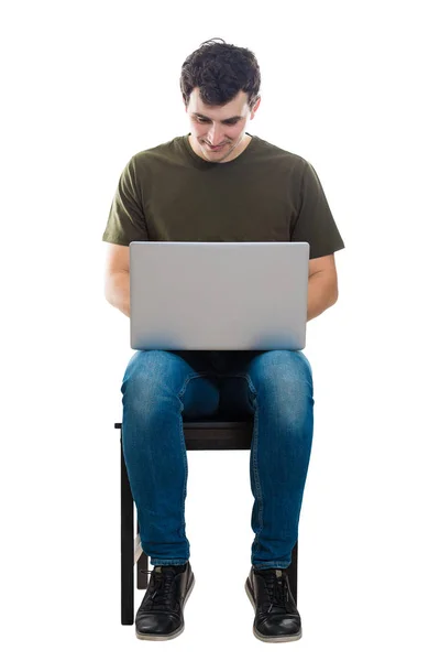 Seated freelancer working on laptop Royalty Free Stock Images