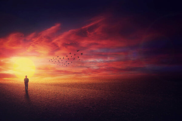 Surreal scenery view as a wanderer guy silhouette walking in fro