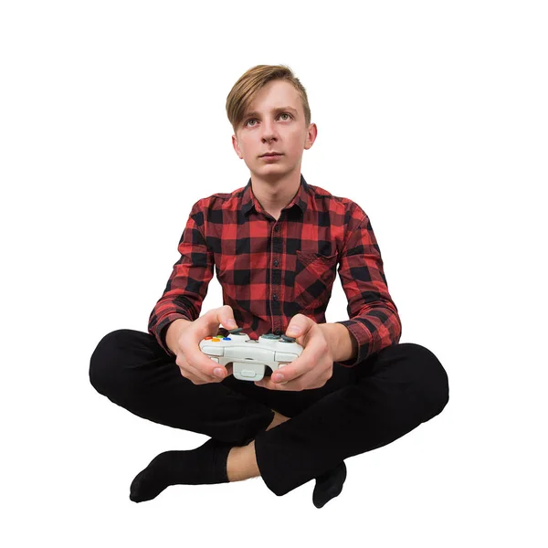 Серйозний намір підліток сидить на підлозі граючи в відеоігри — стокове фото