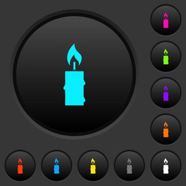 Yanan mum balmumu karanlık tuşlar koyu gri arka plan üzerinde canlı renkler simgelerle erime ile