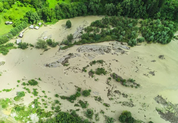 river flood into the lake. Poiana Teiului, Romania. aerial view