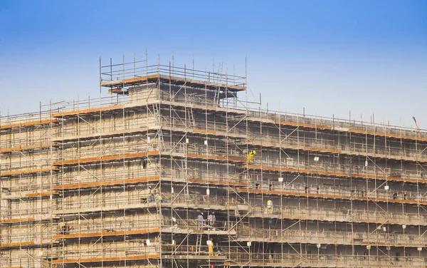 new building under construction and blue sky