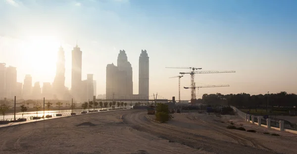 Dubai city under construction with cranes, industrial photo