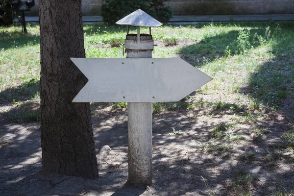 vintage arrow sign of metal in the park