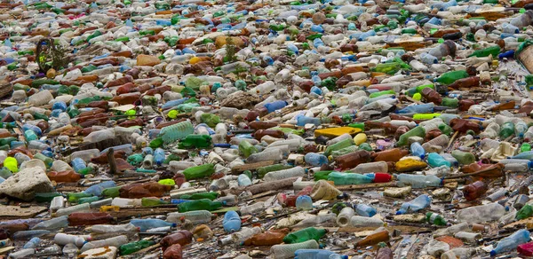 lake pollution with plastic bags in the water