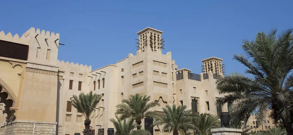 traditional Arab wind tower for air conditioning and cooling on top of building in Dubai, United Arab Emirates