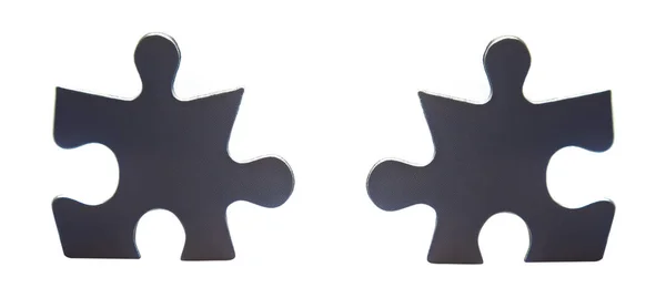 Twee puzzelstukjes onderscheiden van de menigte. bedrijfsconcept — Stockfoto