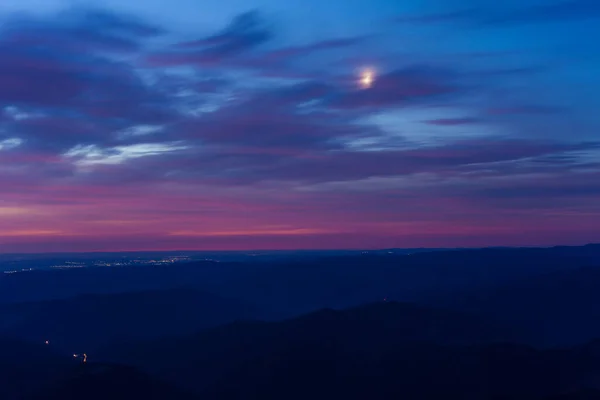 sunrise or sunset under the moon light. mountain landscape