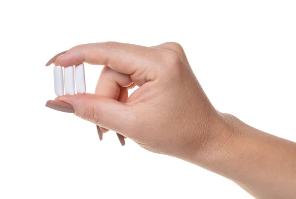 Kauwgom Een Vrouwelijke Hand Witte Geïsoleerde Achtergrond — Stockfoto