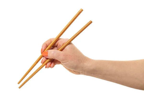 Ženská ruka s hůlkami — Stock fotografie