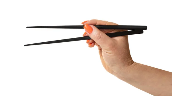 Женская рука с палочками для еды — стоковое фото