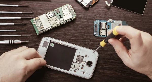 mobile phone repair, hands closeup