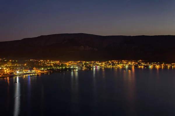 Village Baska at night with sea, island Krk, Croatia