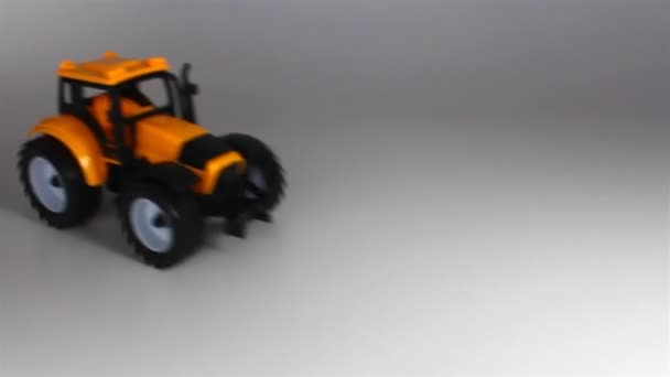 Yellow Tractor Ride Stop Front White Background — Stock Video