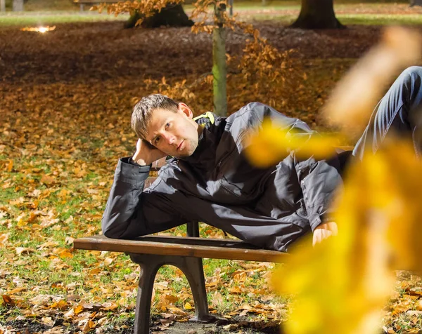Portrait Young Man Lie Bench City Park Night Leaves — Stock Photo, Image