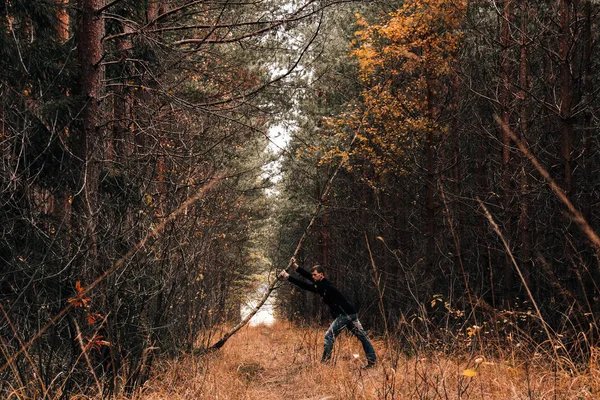 Young Man Autumn Forest Holding Tree — Stock Photo, Image