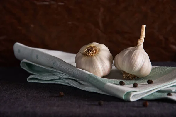Garlic, onion, bay leaf, black pepper on a napkin. Garlics. sliced garlic, garlic clove garlic bulb
