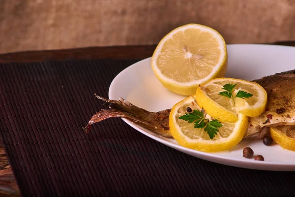 Baked Fish Lemon Spices Herbs White Plate Wooden Background — Stock Photo, Image