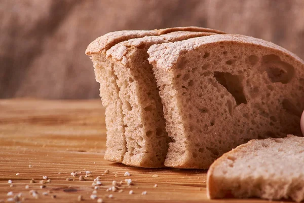 slices of bread and crumbs on wooden table. pleace for text. Copyspace