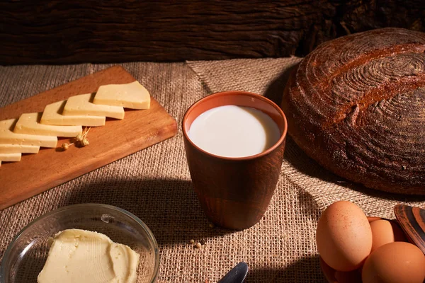 stock image Assorted dairy products milk, cheese, butter rustic still life on table