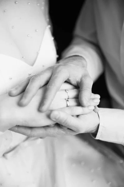 Black and white photo shoot, love story, lovers, man and woman on a black background, body details